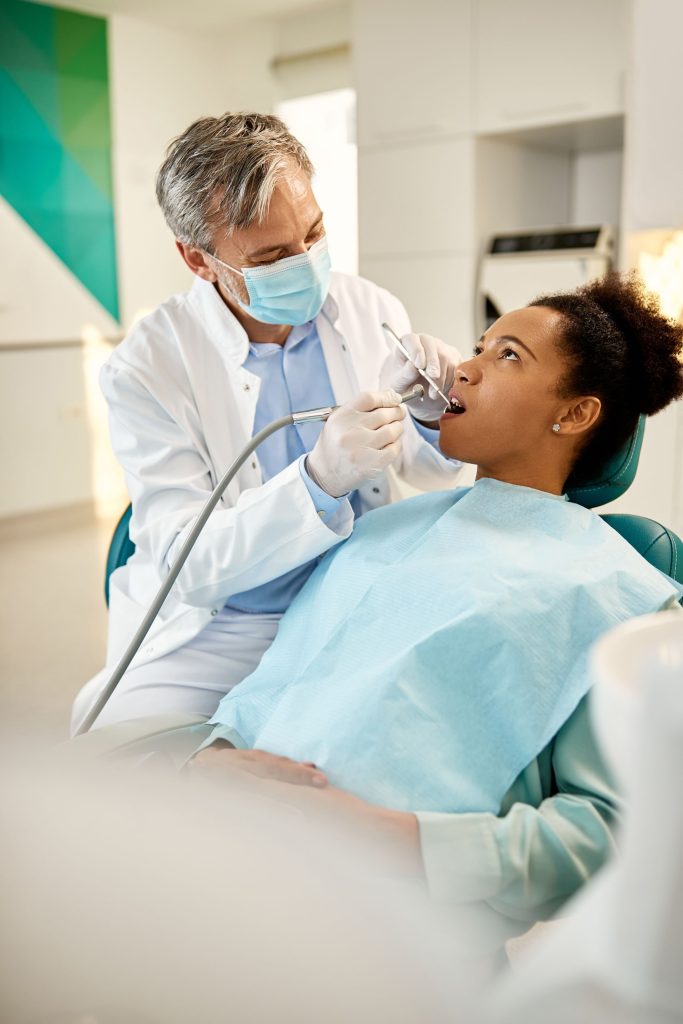 man using dental drill