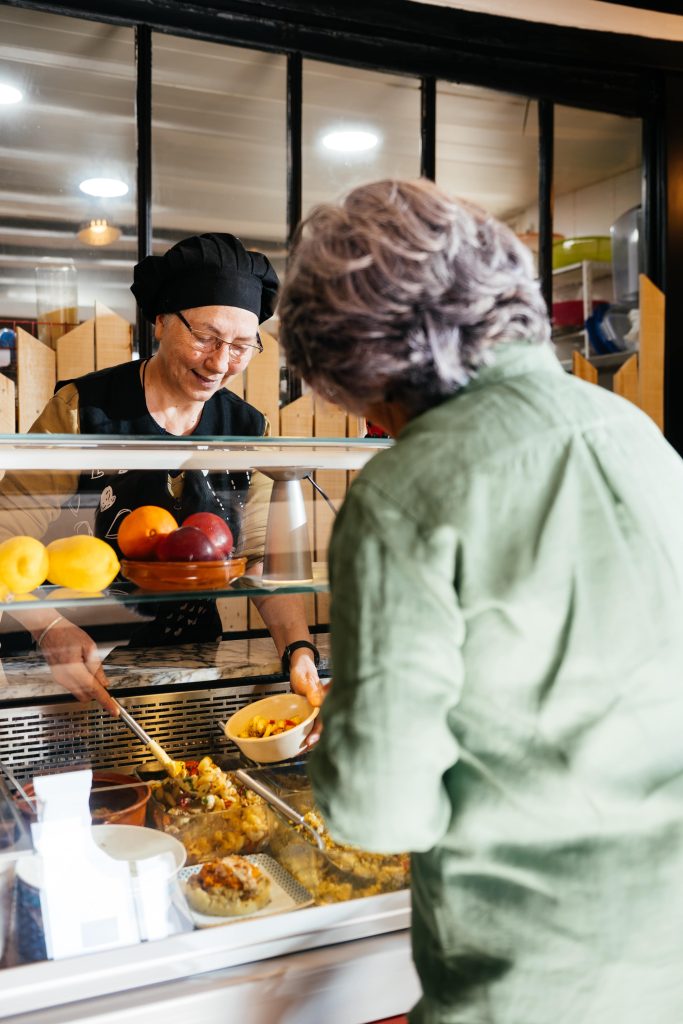 woman at counter ordering food