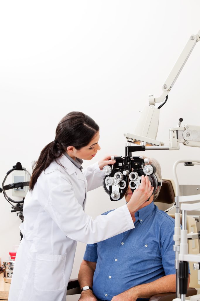 female optometrist giving exam to female patient