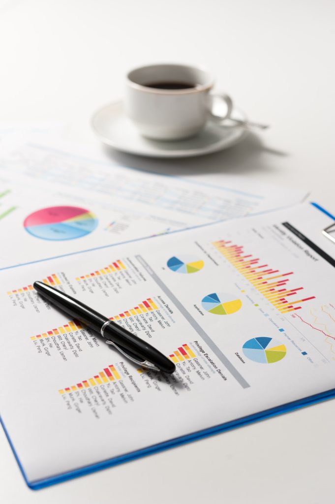 financial spreadsheet with pen and coffee mug